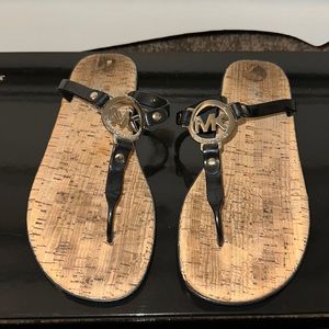 Michael Kors sandals size 8. Black with corkscrew bottom, silver MK logo.
